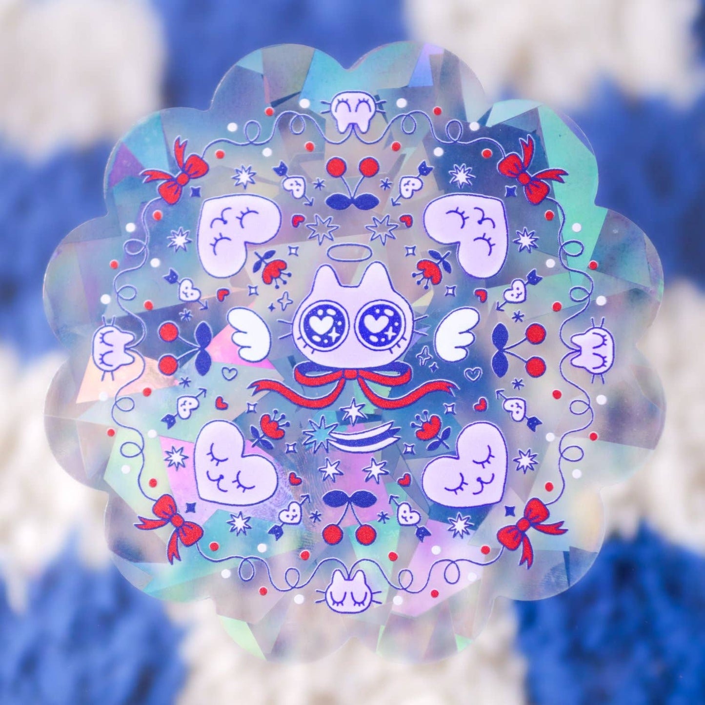 Angel Suncatcher Sticker, Radhia Rahman, Holographic sticker with cartoon character and decorative elements on a blurred natural background