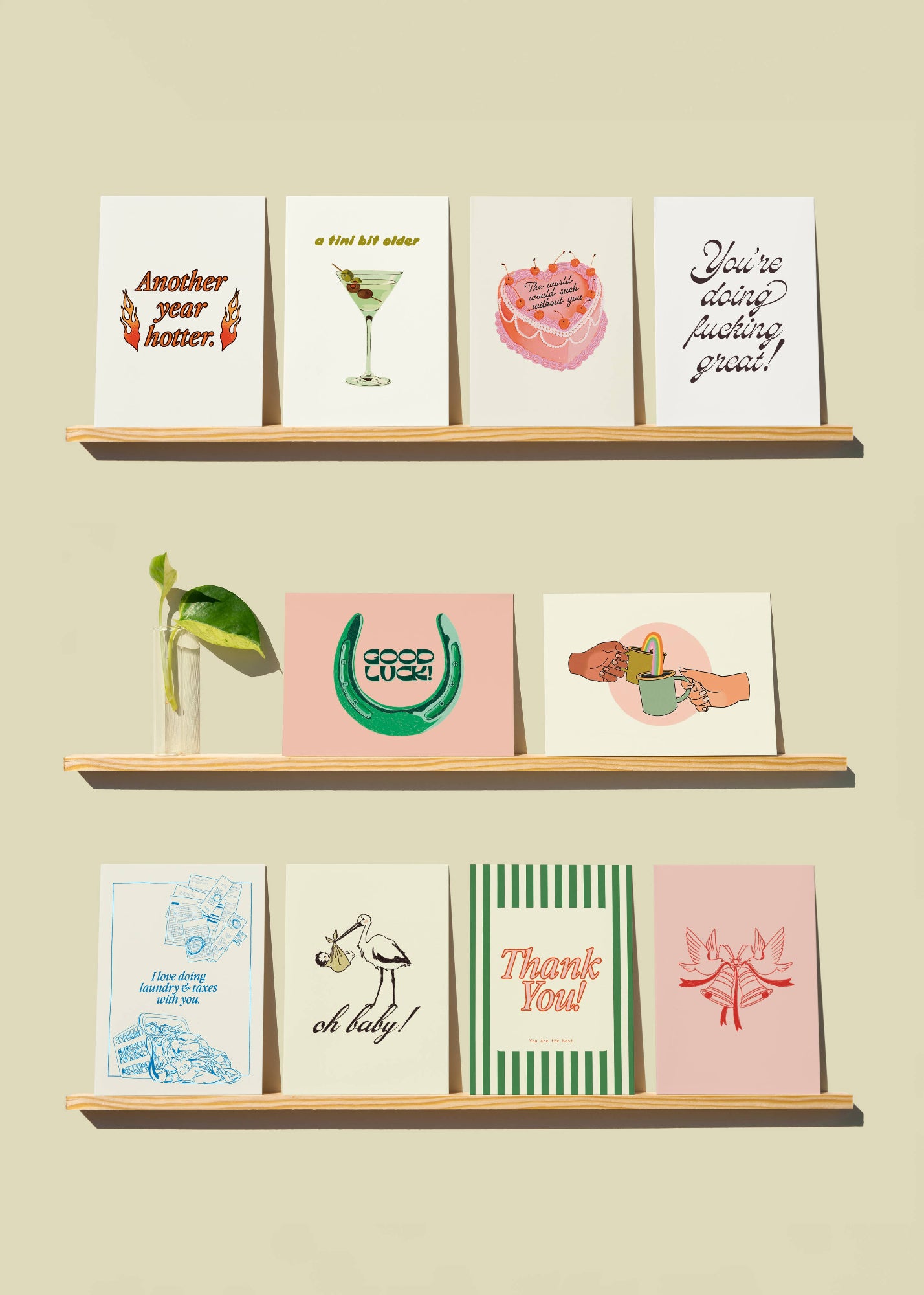 Shelves with various greeting cards on a beige wall