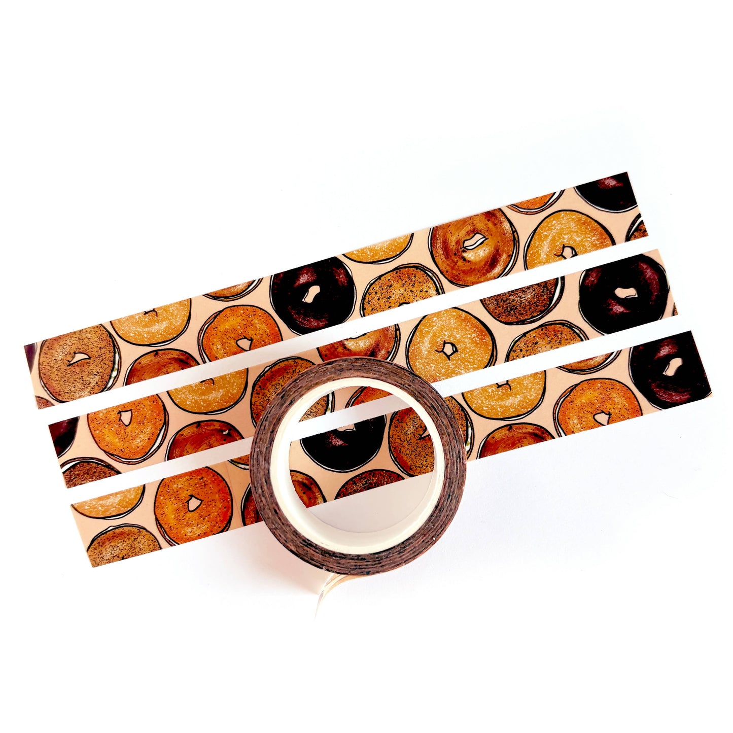 Roll of tape with bagel pattern on a white background