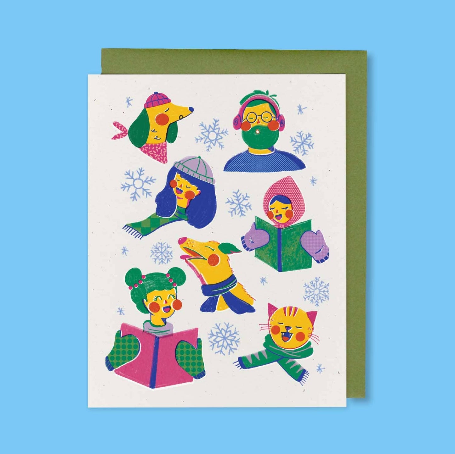 Colorful illustration of characters wearing winter accessories on a white card with a green envelope against a blue background. Carolers Holiday Greeting Card