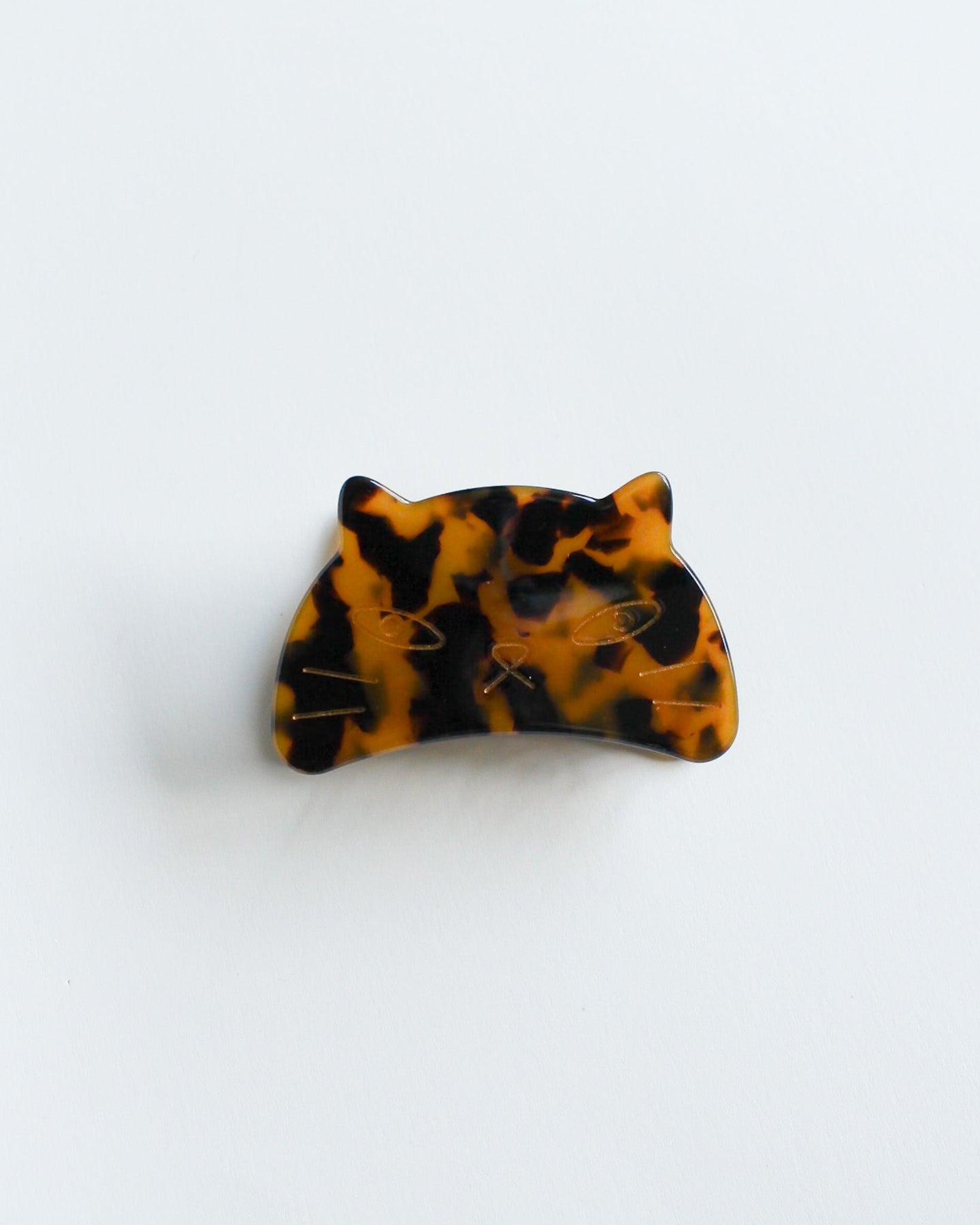 Cat Hair Claw Clip Tortoiseshell patterned hair clip on a white background