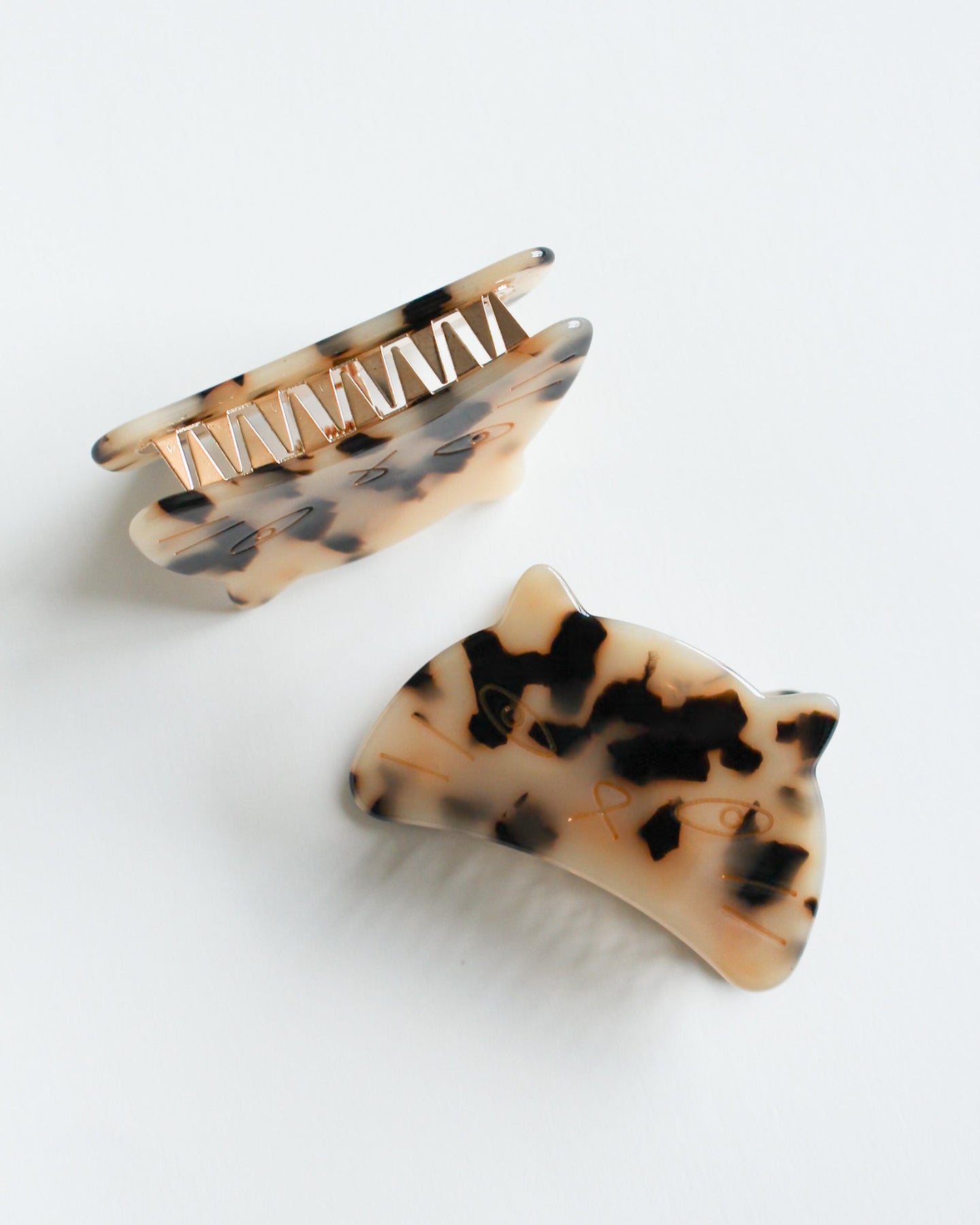 Cat Hair Claw Clip Two tortoiseshell patterned hair clips on a white background