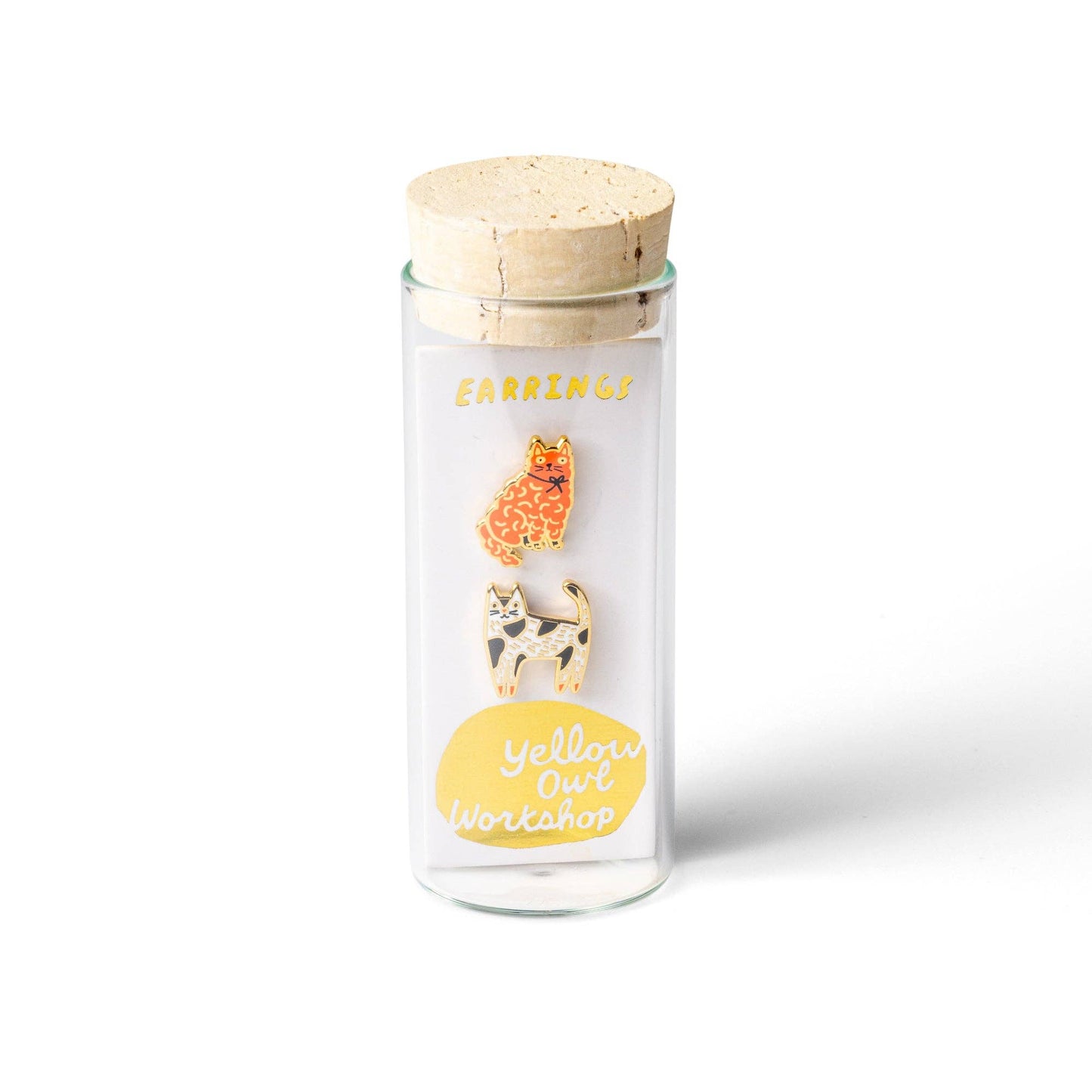 Glass jar with wooden lid containing animal-themed pins on a white background