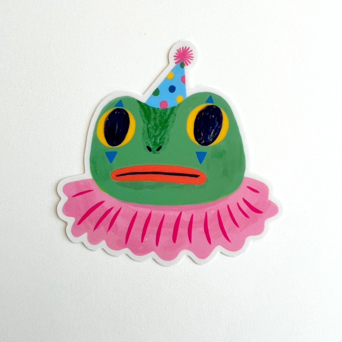 Colorful frog sticker with a party hat and pink skirt on a white background