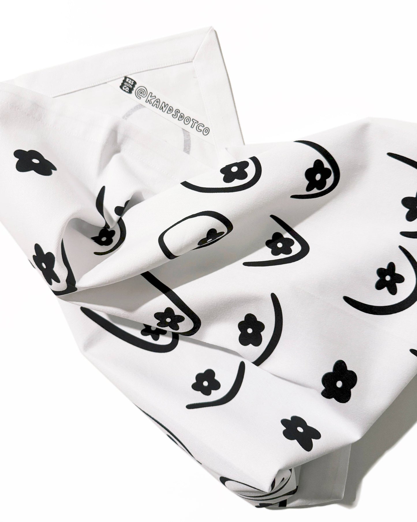 White bandana with black floral patterns on a white background