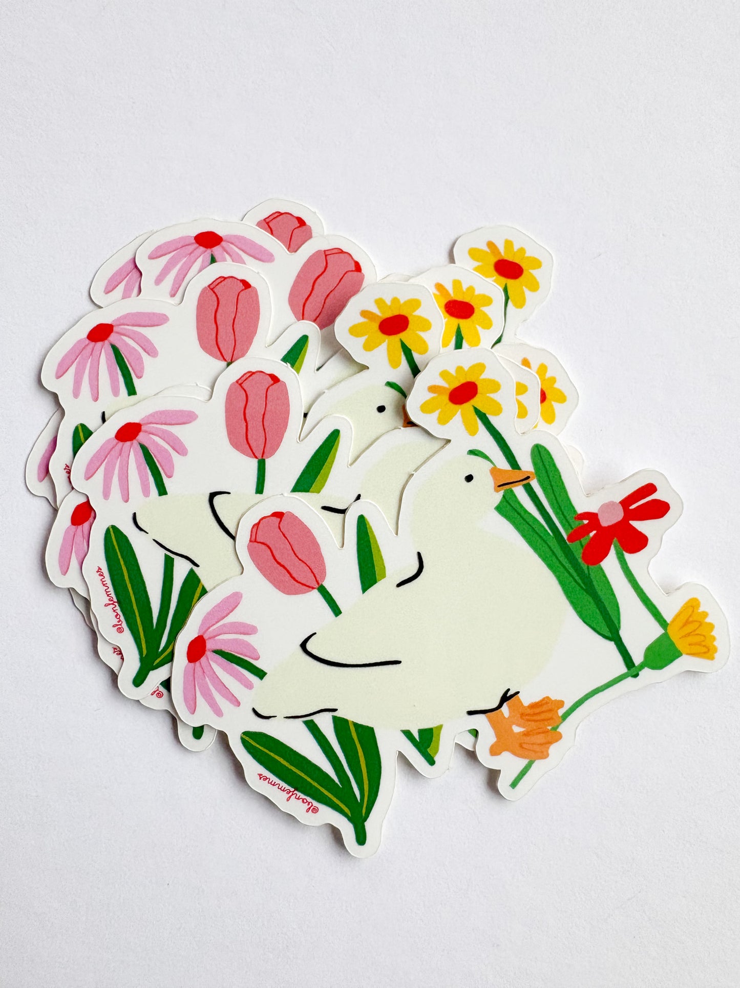 Set of stickers with ducks and flowers on a white background