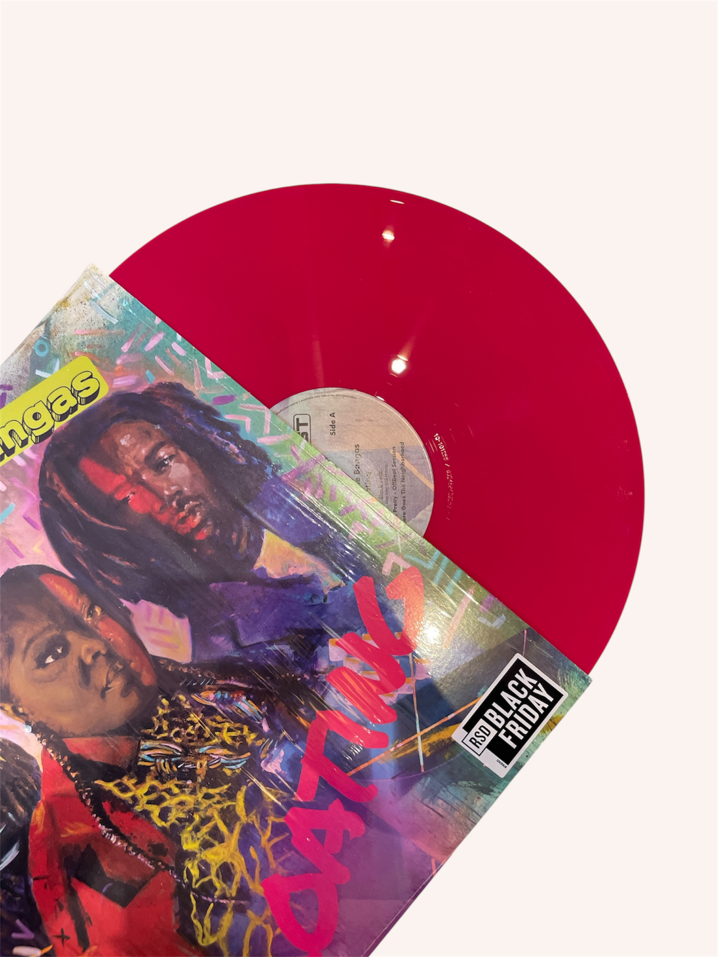 Vinyl record with colorful cover featuring two people and the word 'Catching Fire'.