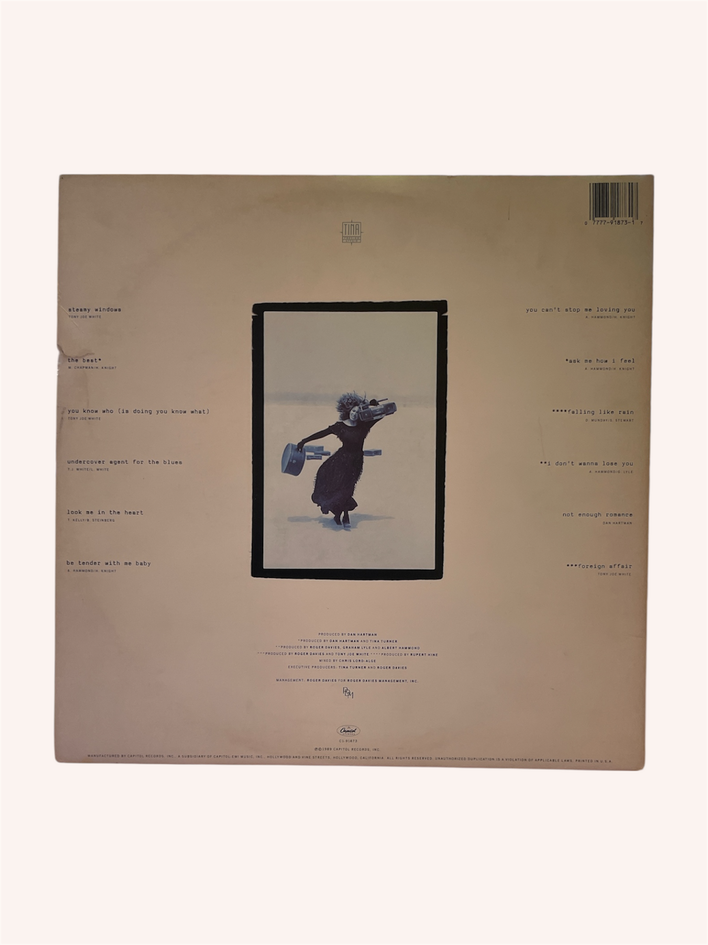 Album cover with a illustration of a person holding a fish on a beige background, Foreign Affair Vinyl Record - Tina Turner