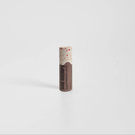 Lip balm with visible brand name on a white background, Gingerbread Latte Lip Balm