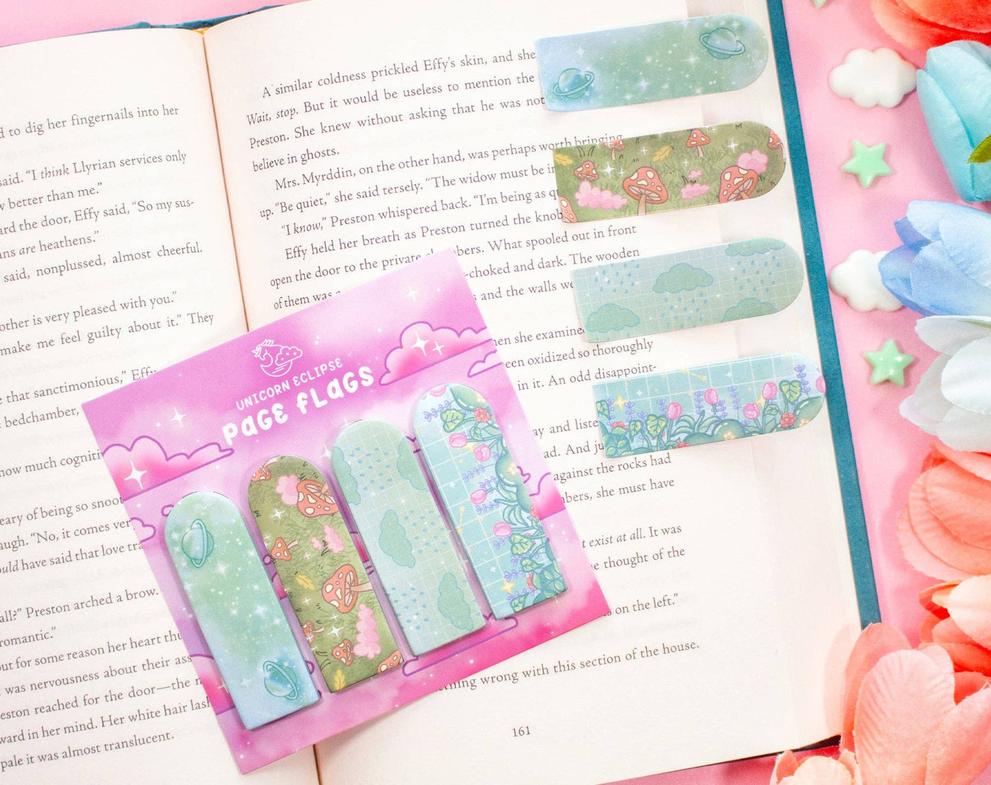 Pack of unicorn-themed page flags on a book with colorful decorations.