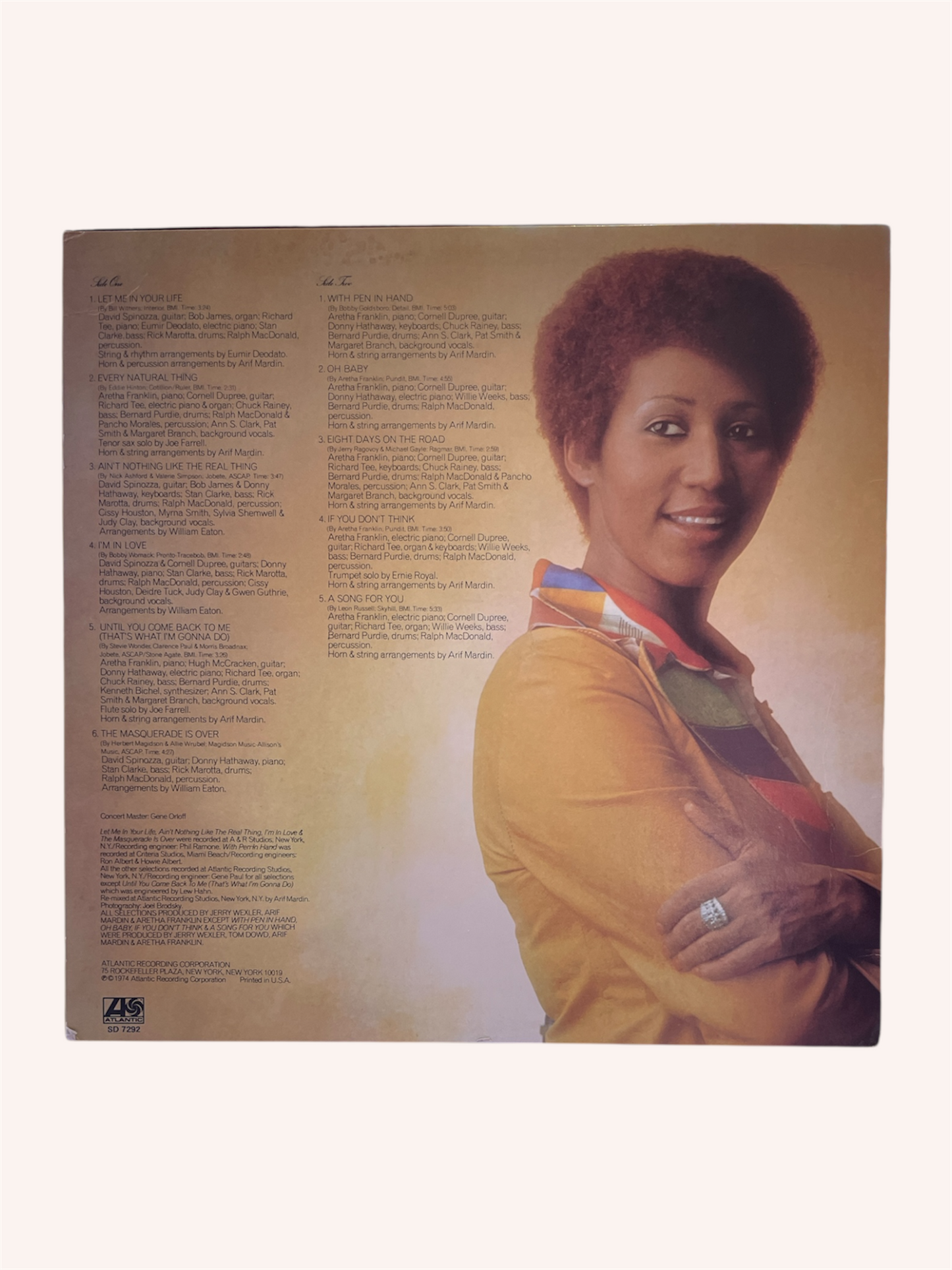 Album cover with a person on the back, featuring text and a portrait.