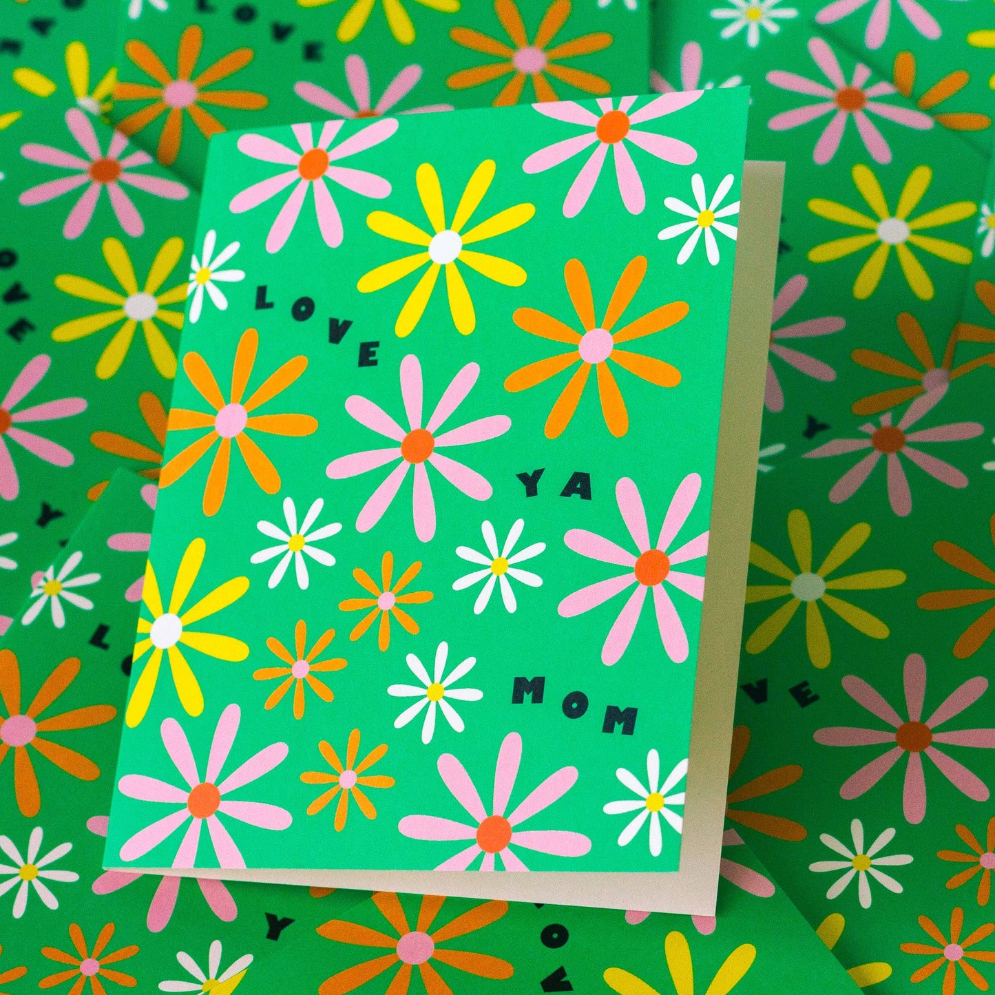 Greeting card with floral design and text on a matching floral background