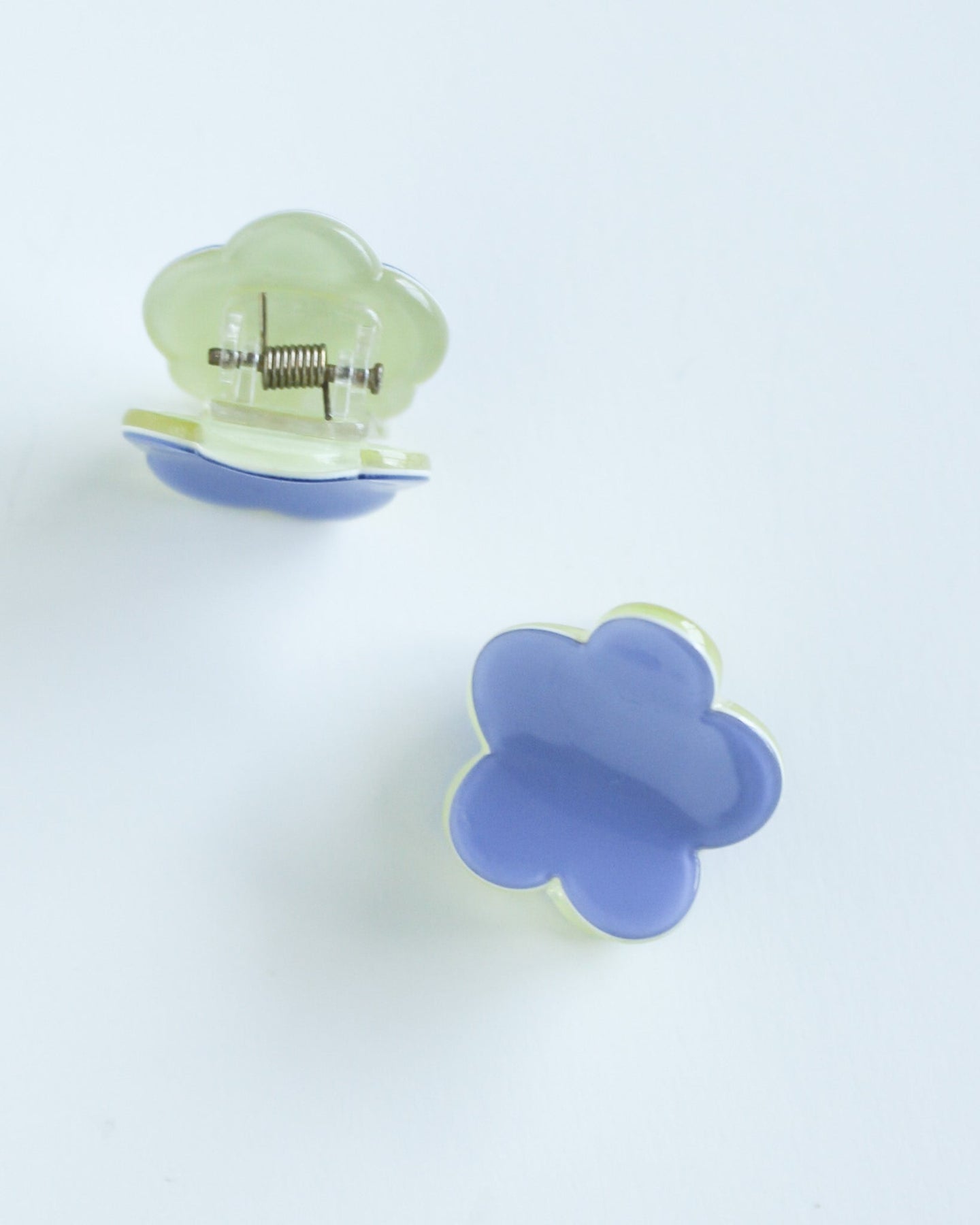 Mini Daisy Hair Claw Clip Two colorful hair clips on a white background