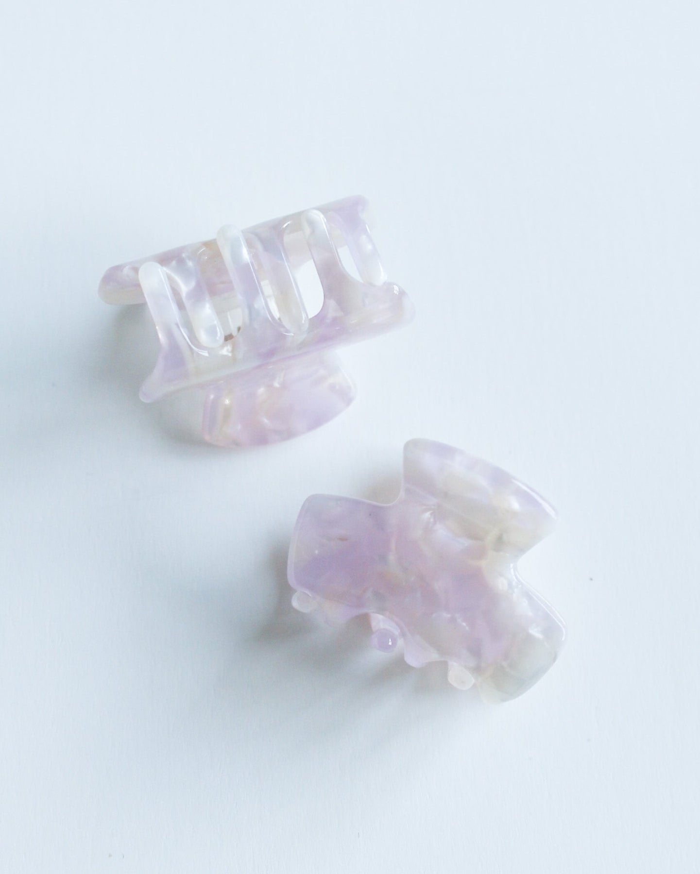 Mini Hair Claw Clip Two purple hair clips on a white background