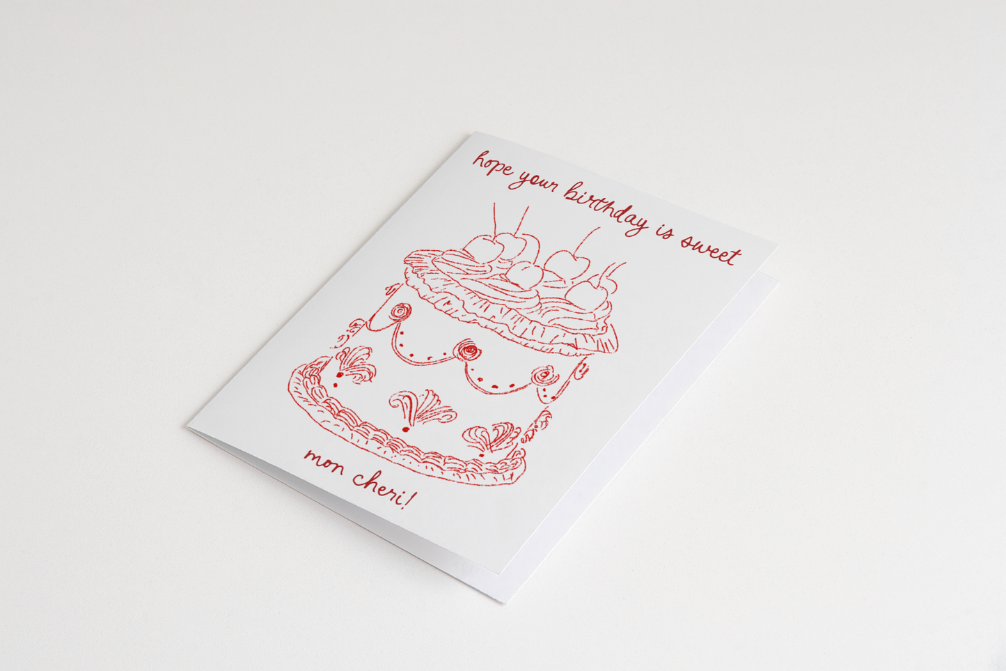 Greeting card with a cake illustration and text on a white background