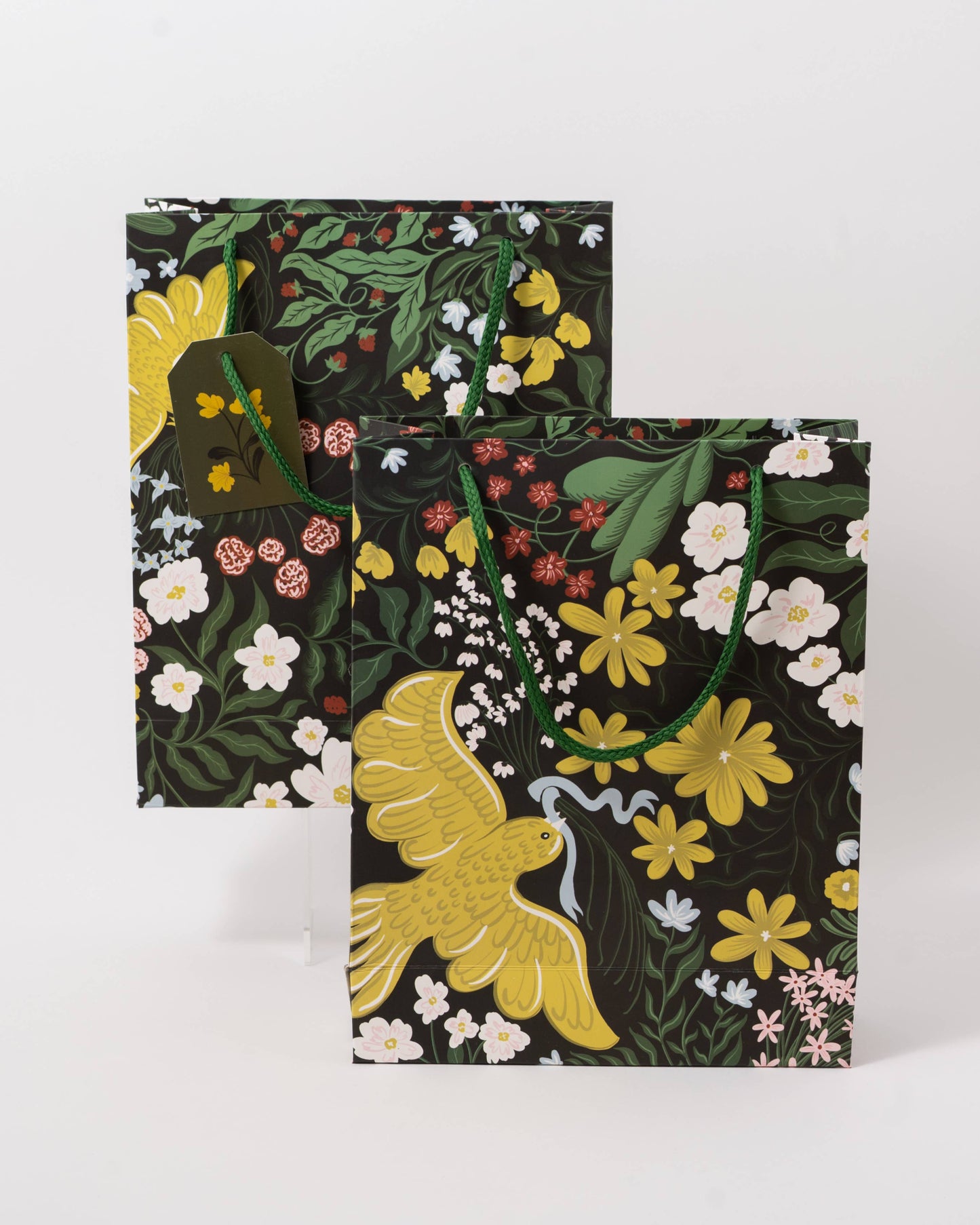 Floral-patterned bags with a bird design on a white background, Of A Feather Medium Paper Gift Bag