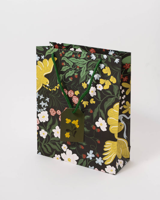 Floral-patterned gift bag with a tag on a white background, Of A Feather Medium Paper Gift Bag