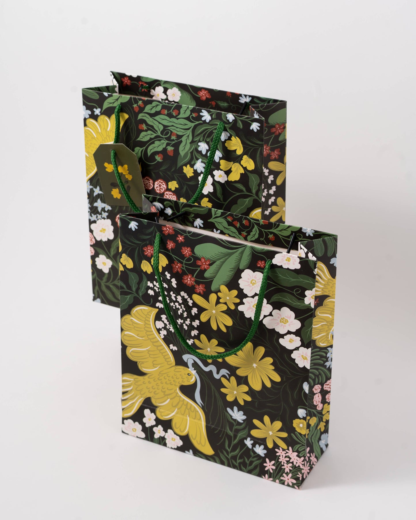 Floral-patterned gift bags on a white background