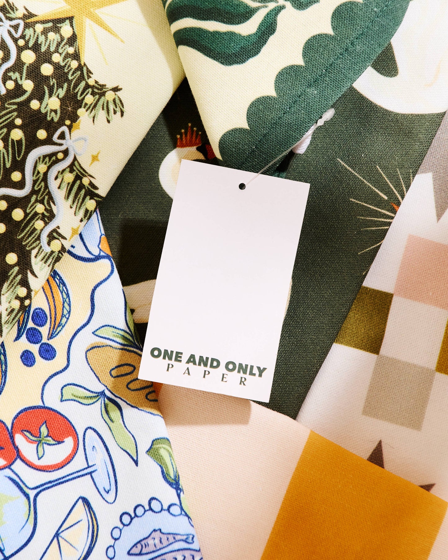 Collection of patterned paper samples with a 'One and Only Paper' tag.