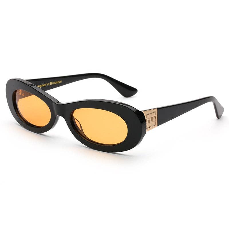 Black sunglasses with yellow lenses on a white background