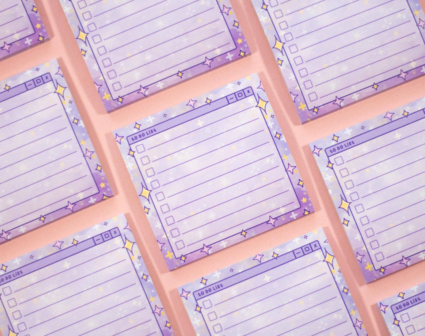 Set of purple notepads with checklists and star designs on a pink background