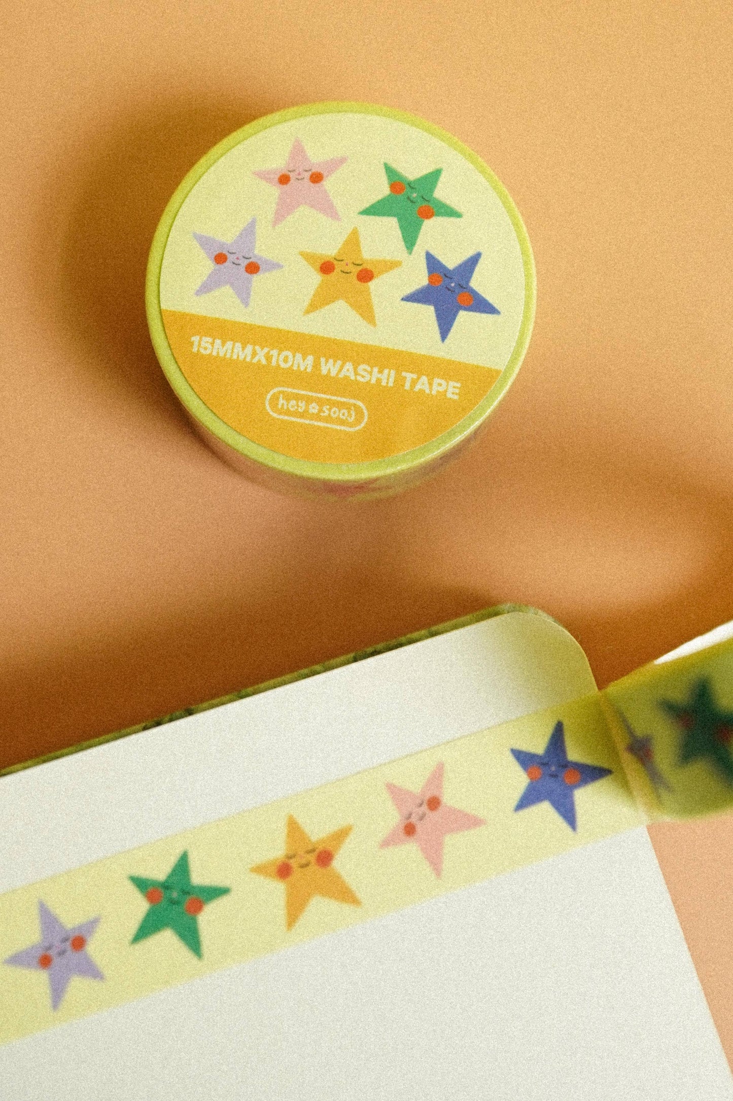 Washi tape with colorful star designs on a beige background, Stellar Washi Tape