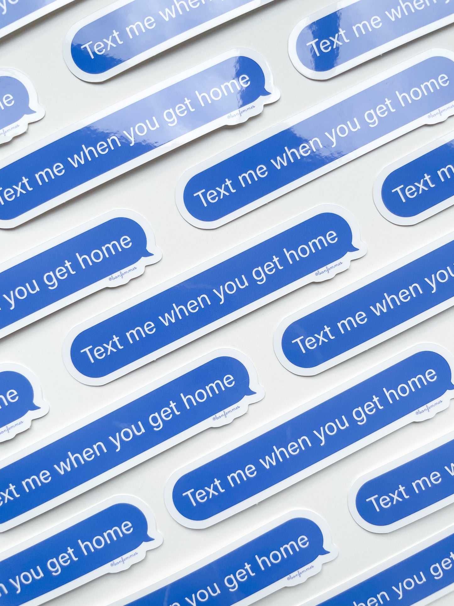 Repeating pattern of blue text message bubbles on a white background