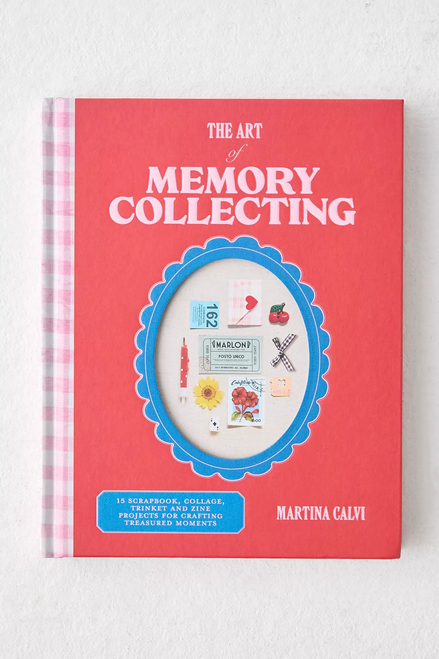 Book titled 'The Art of Memory Collecting' by Martina Calvi on a white background