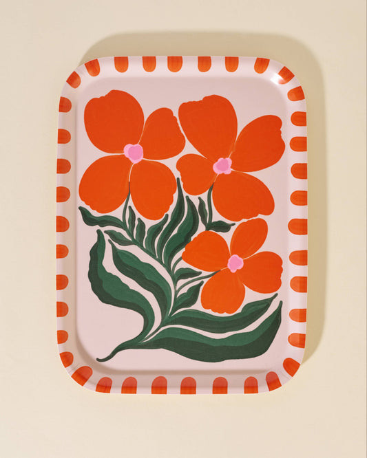 Rectangular tray with orange floral design on a beige background. Wild Flower Serving Tray One & Only Paper