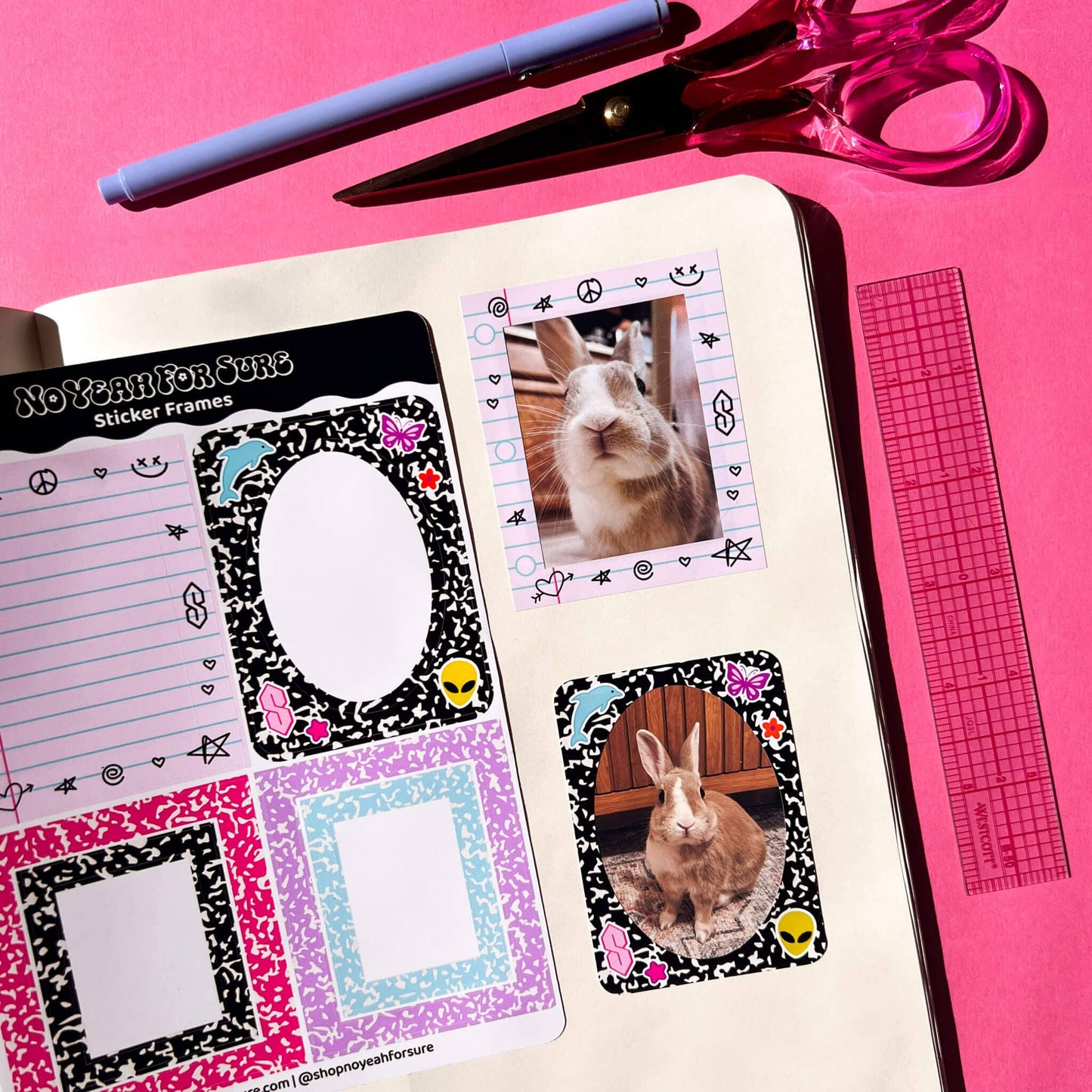A styled flat-lay of a bullet journal planner page featuring Easter-themed stickers, including bunny photo inserts and patterned frames, with a pen, scissors, and ruler on a bright pink background.