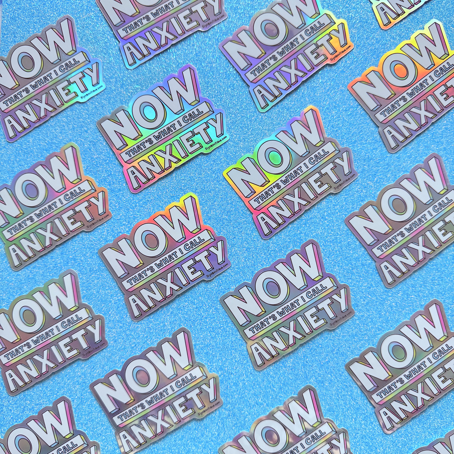 Pattern of 'NOW THAT'S WHAT I CALL ANXIETY' stickers on a blue background
