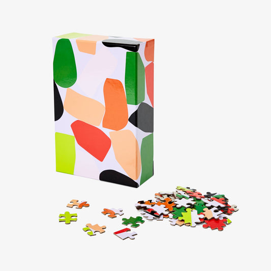 Colorful puzzle box with scattered puzzle pieces on a white background, 500 piece Stack Pattern Puzzle
