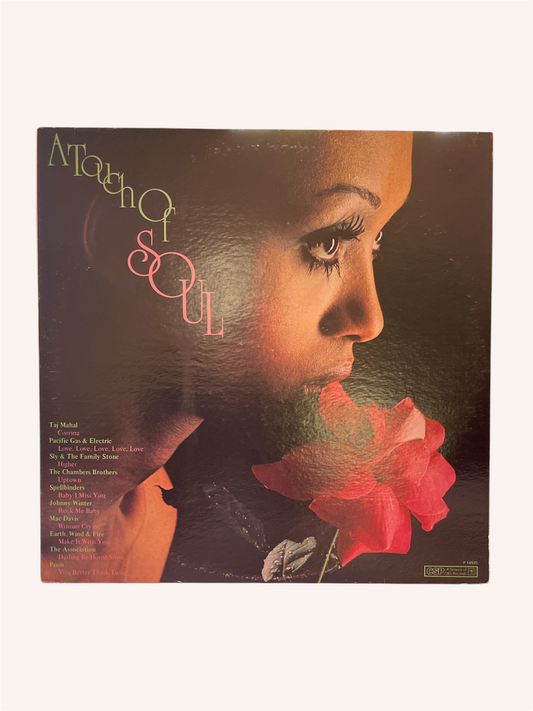 Vinyl record cover with a person holding a red flower, featuring the text 'A Touch of Soul'. A Touch of Soul Vinyl Record - Artist Compilation