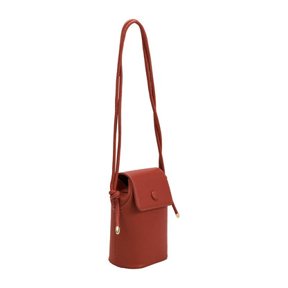 Red leather crossbody bag on a white background