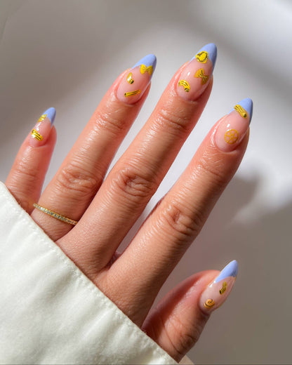 Hand with pastel blue and pink nails with gold accents on a neutral background, Al Dente Pasta Nail Art Stickers