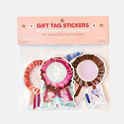 Packaged gift tag stickers with assorted designs on a white background
