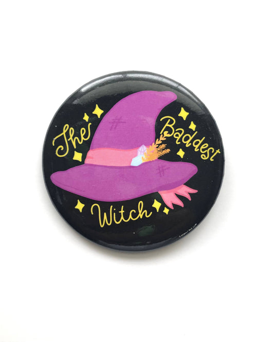Button badge with purple witch hat and text 'The Baddest Witch' on a black background