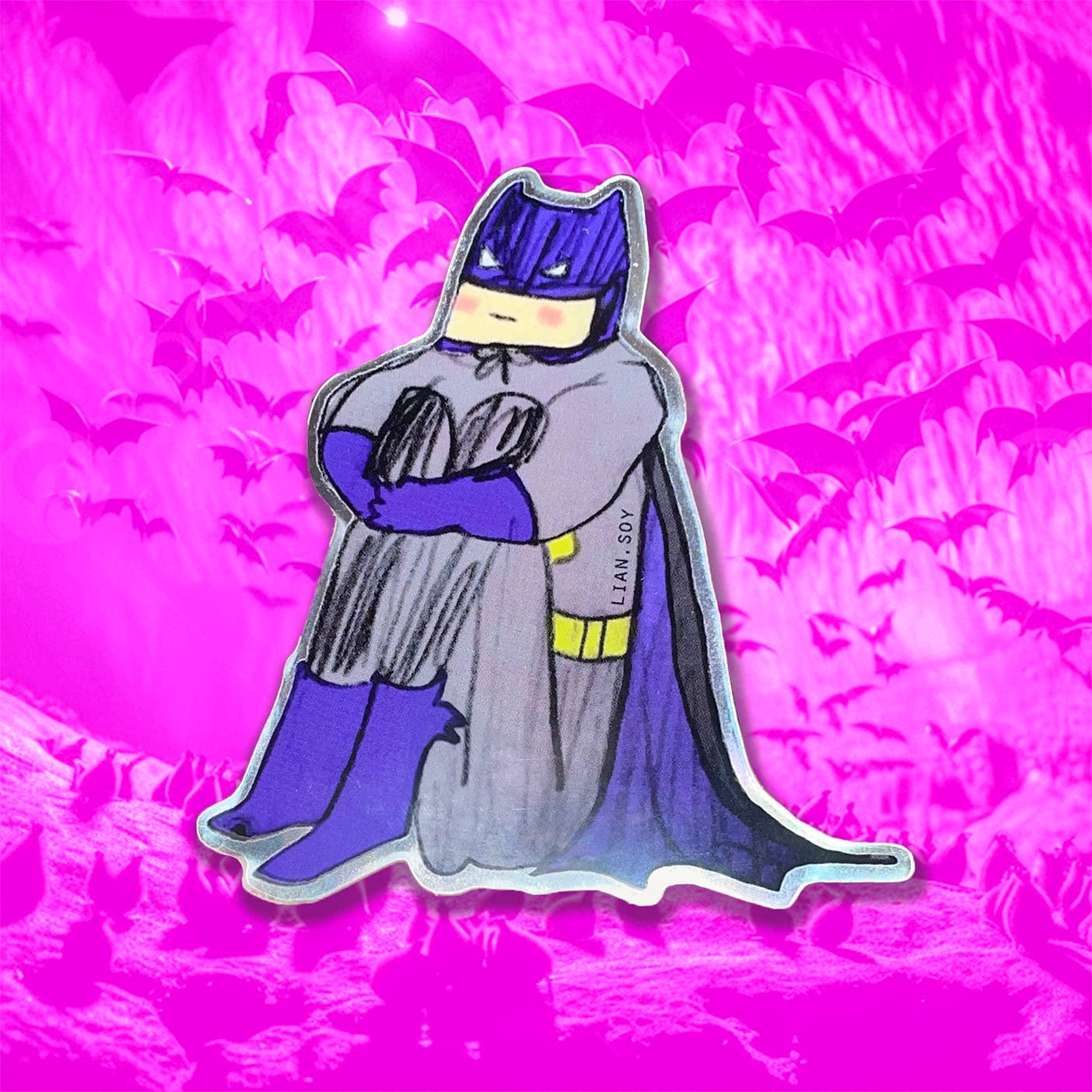 Batman figurine with a pink background