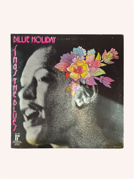 Vinyl record cover with a stylized portrait and floral design, featuring the name 'Billie Holiday'. Billie Holiday Sings the Blues Vinyl Record - Billie Holiday