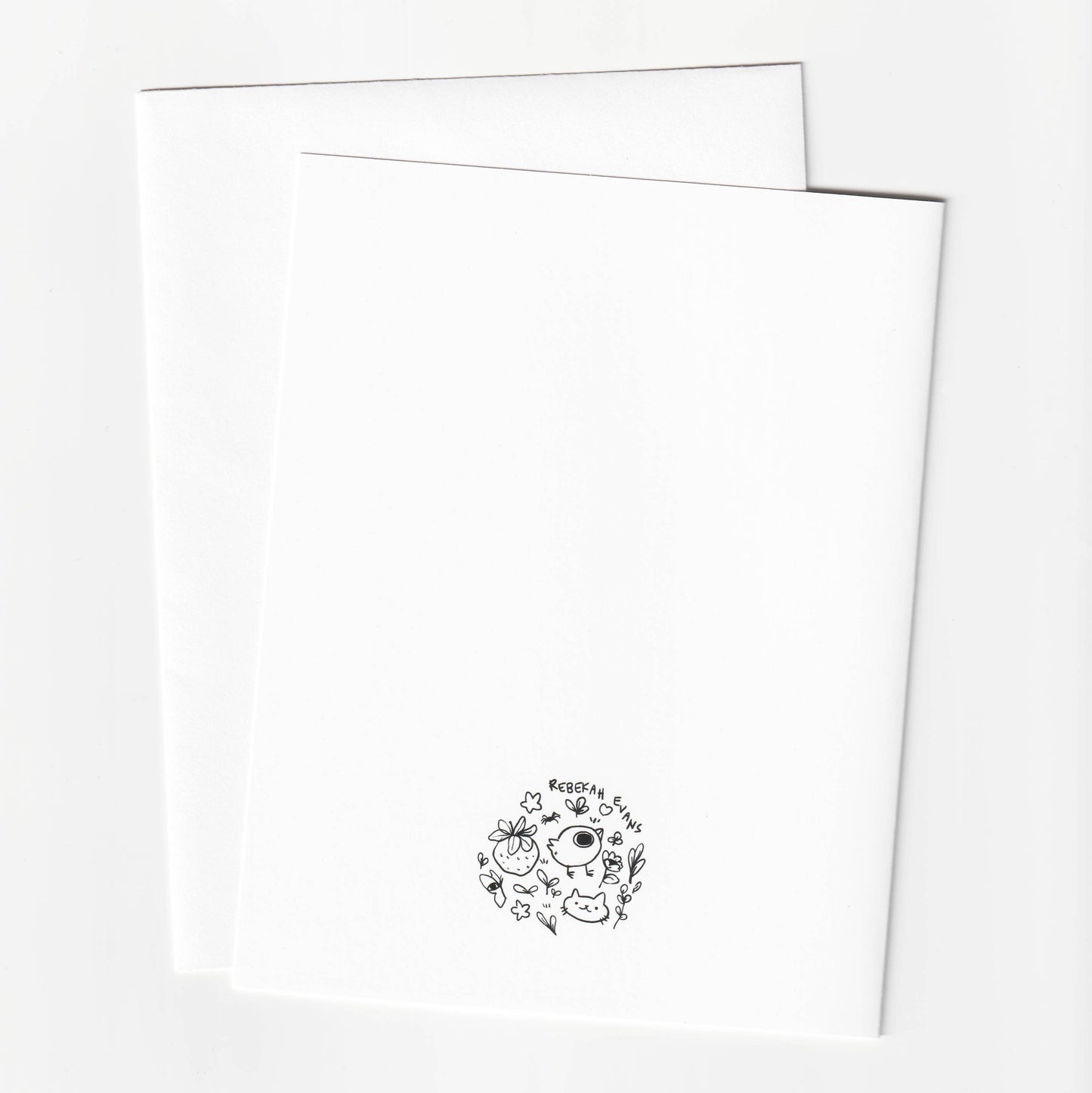 Two white sheets of paper with a black logo on a white background