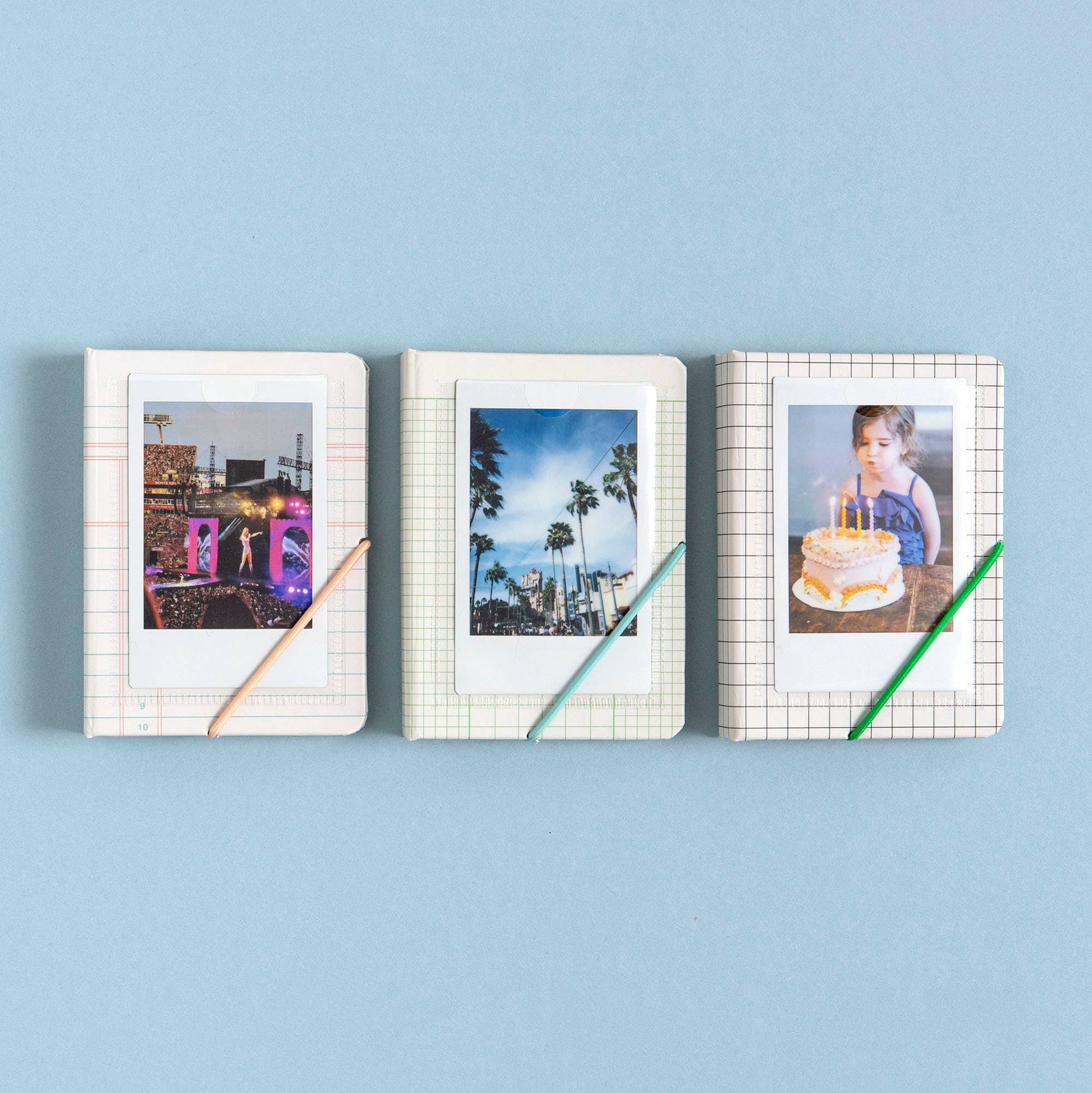 Three photo frames with different images on a blue background