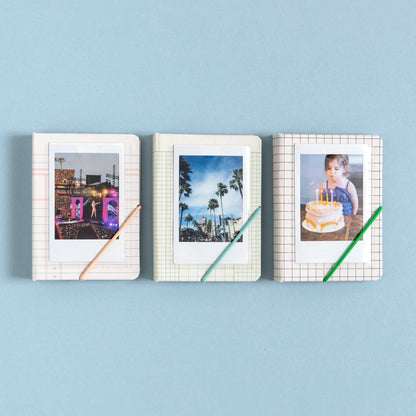 Three photo frames with different images on a blue background