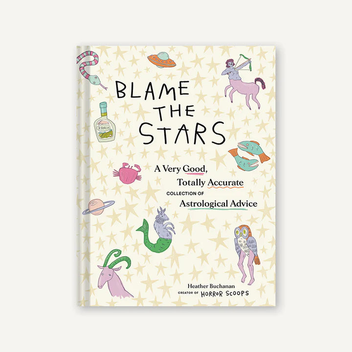 Book cover of 'Blame the Stars' with astrological designs on a light background