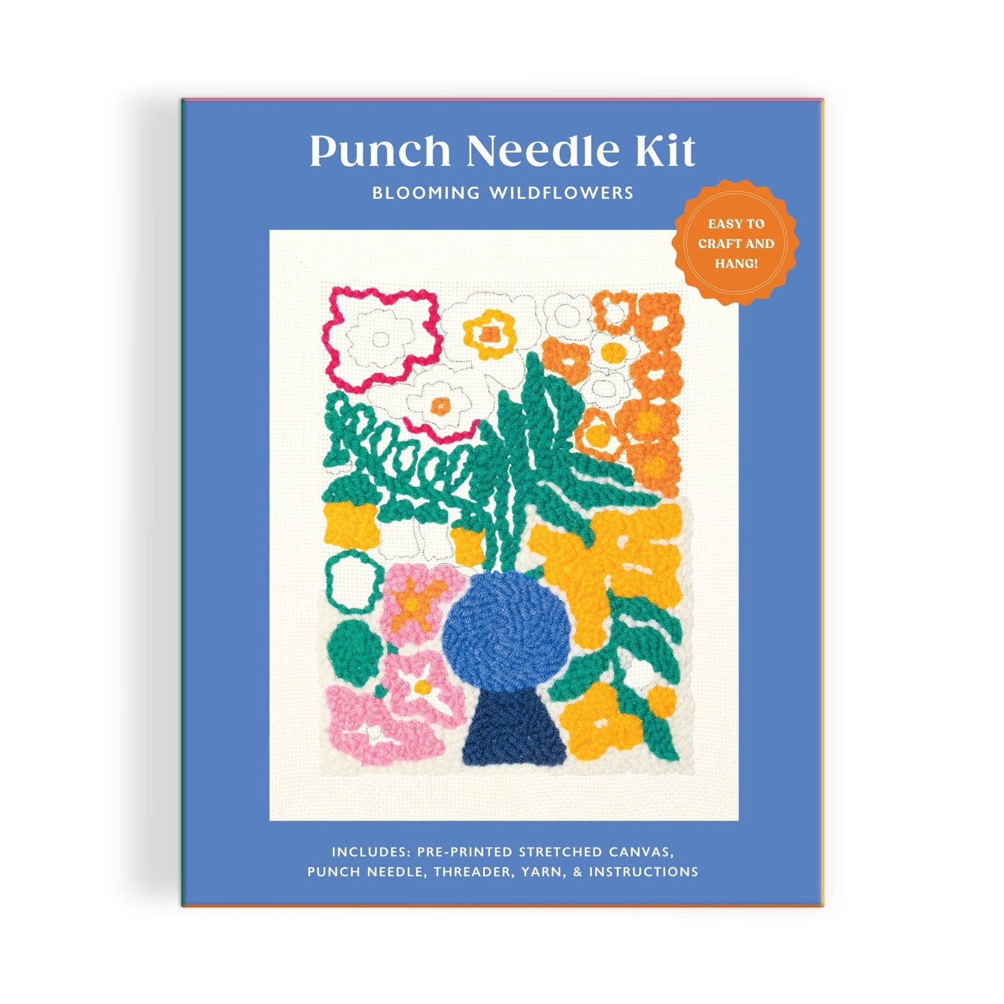 Punch needle kit packaging with floral design on a blue background