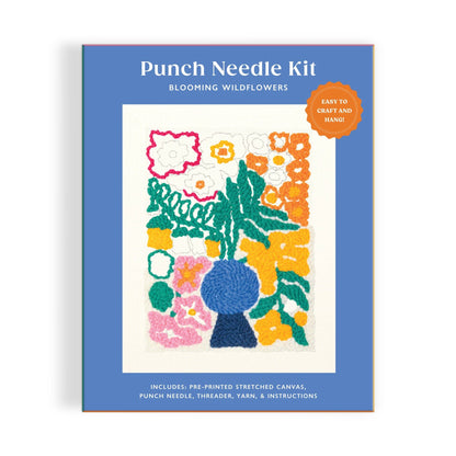 Punch needle kit packaging with floral design on a blue background