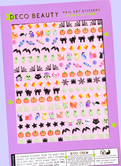 Halloween-themed nail art stickers on a purple sheet with 'Deco Beauty'. Boo Crew Glow in The Dark Nail Art Stickersbranding.