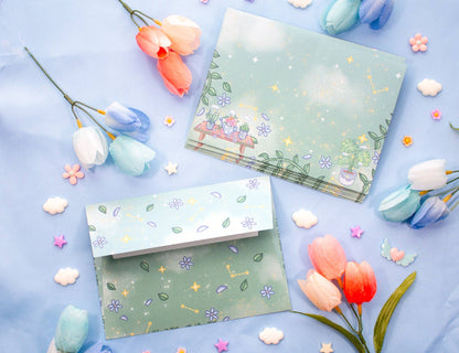 Floral stationery set with envelopes and cards on a blue background