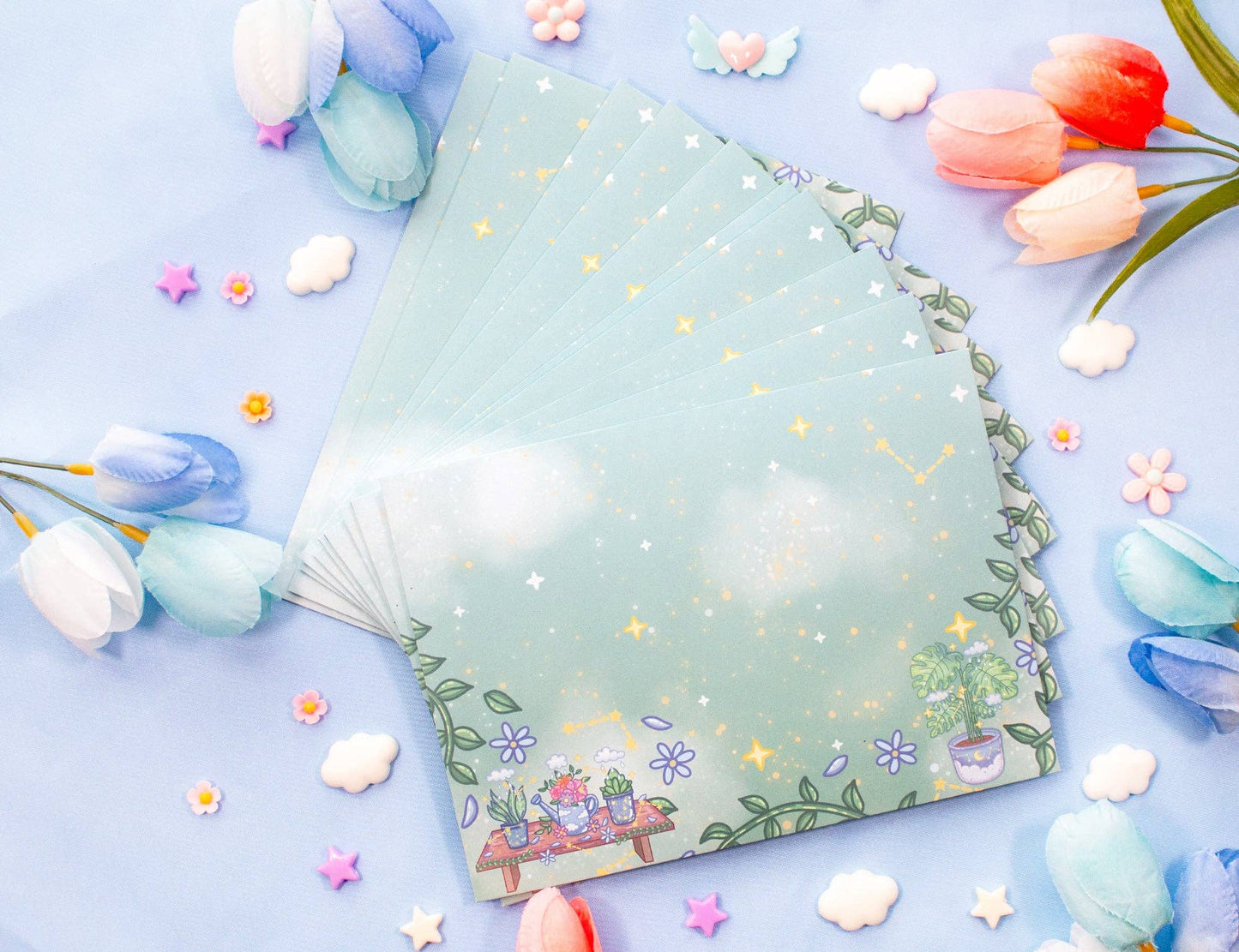 Floral notebook on a light blue background with decorative flowers
