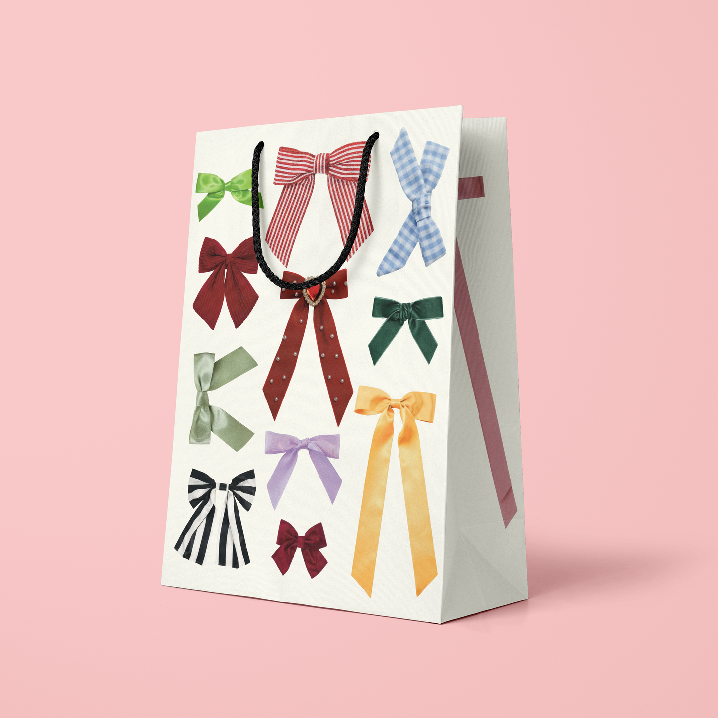 Gift bag with colorful bows on a pink background