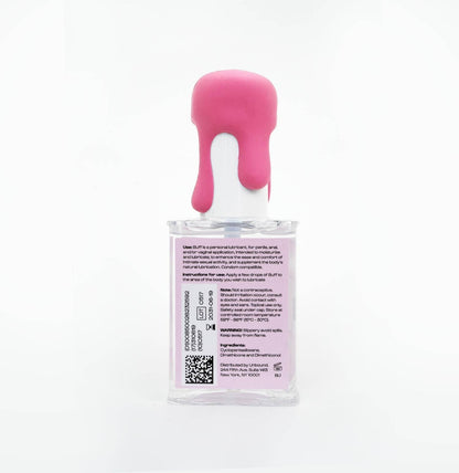 The back of a clear plastic bottle of Dr. Brandt's Beauty Care hair product, featuring a bright pink dripping wax seal on the cap and a white label with black text and a QR code.